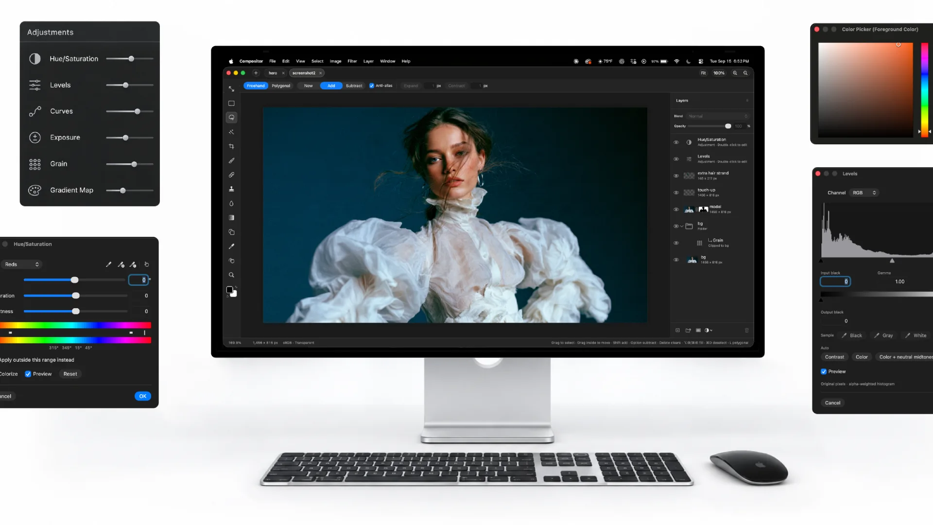 Compositor editing a portrait on an external display with adjustment panels and a colour wheel